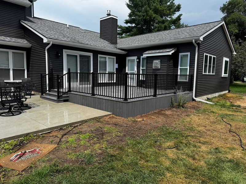 Home exterior with new siding, trim and a composite deck