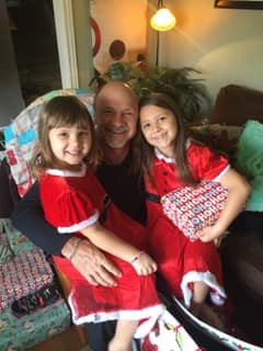 A member of the All American Remod family at home with his granddaughters