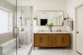 Bathroom with freshly painted walls, white trim and a wood vanity