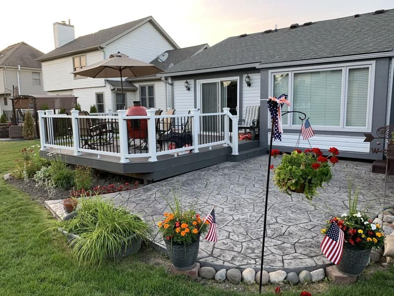 Deck and patio outdoor living space at the rear of a Michigan home