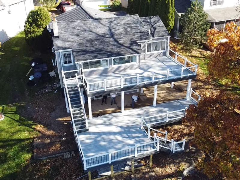 Aerial view of a large custom deck at a Brighton, Michigan lake home
